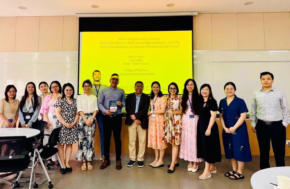 Dr. Mazhar Islam poses with faculty, researchers, and attendees following his entrepreneurship research presentation at VinUniversity in Hanoi, Vietnam.