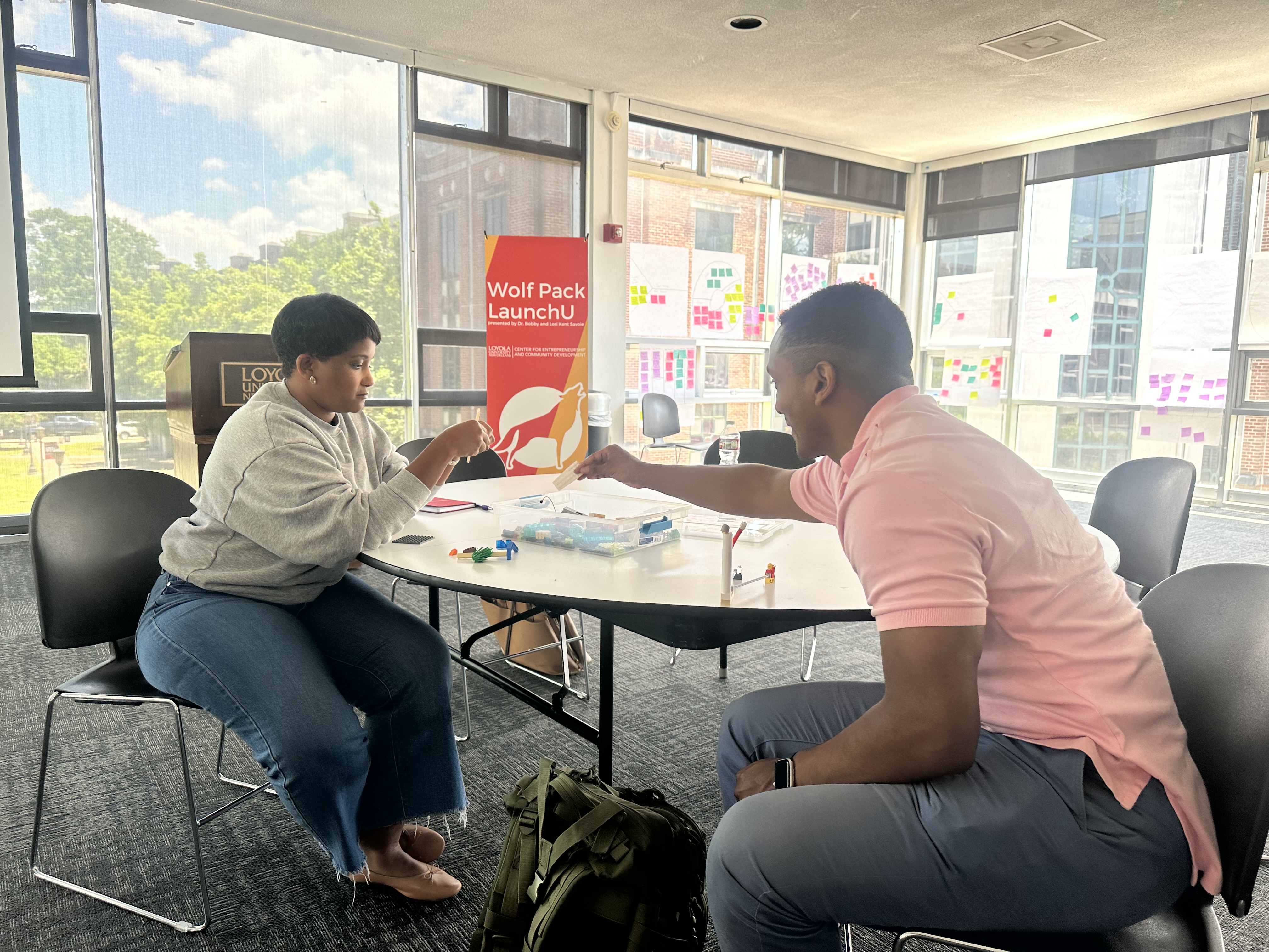 Joshua and Temika using legos to build their mentorship practices.