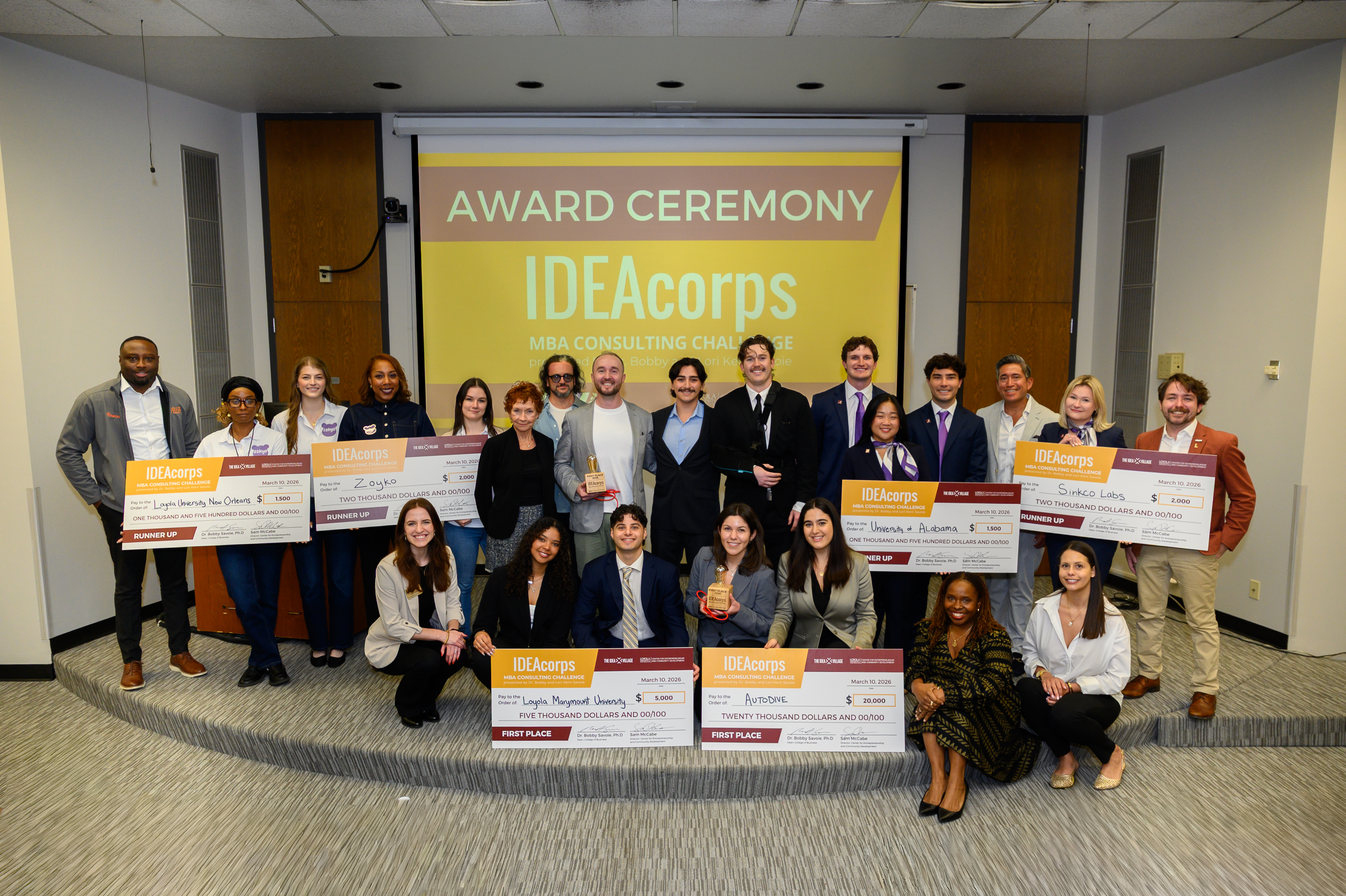 Group photo of winning IDEAcorps teams with judges